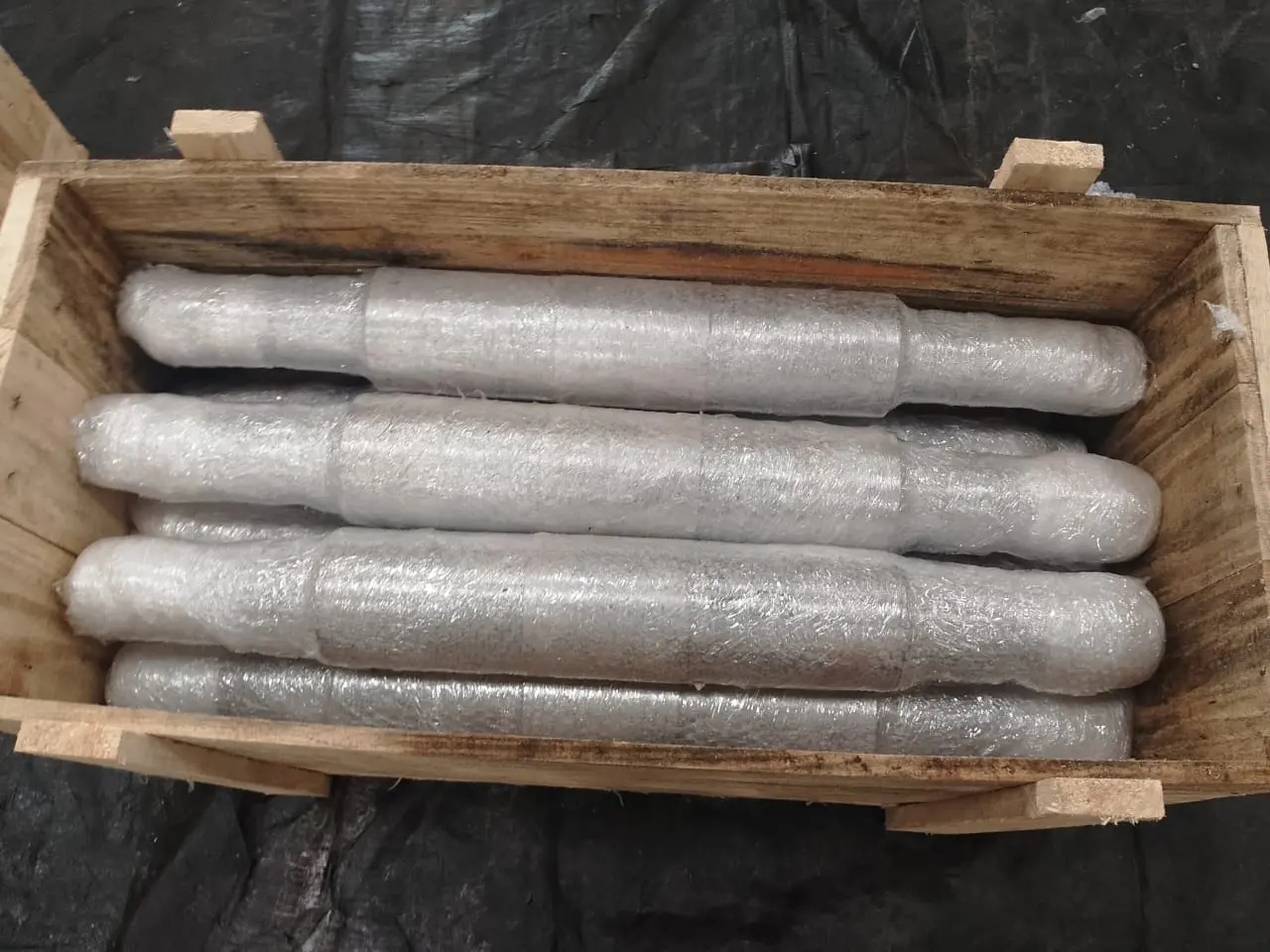 Backup roll shafts protected in wooden packing