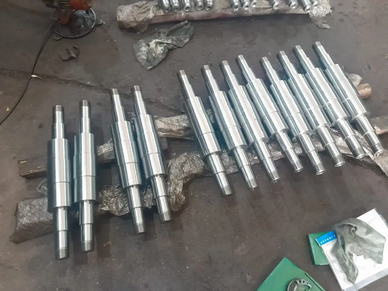 Precision-machined backup roll shafts